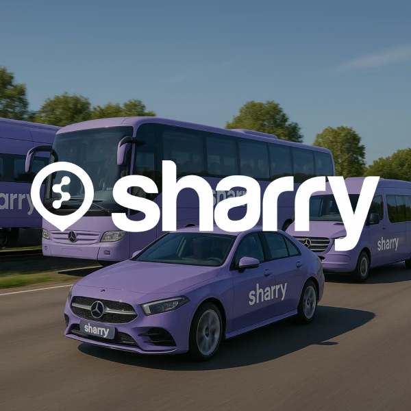 логотип і назва компанії Sharry на фоні фіолетових автобуса, буса, потяга та автомобіля